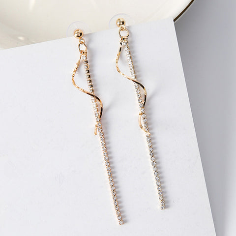 Spiral-shaped drop earrings in gold