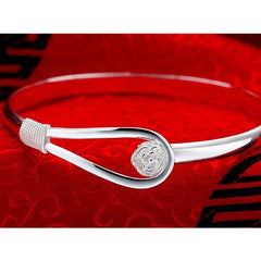 Silver bangle with flower detail