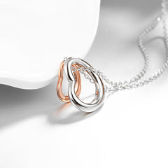 Necklace with heart pendants in white and rose gold