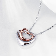 Necklace with heart pendants in white and rose gold