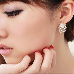 Multilayered earrings with crystal detail